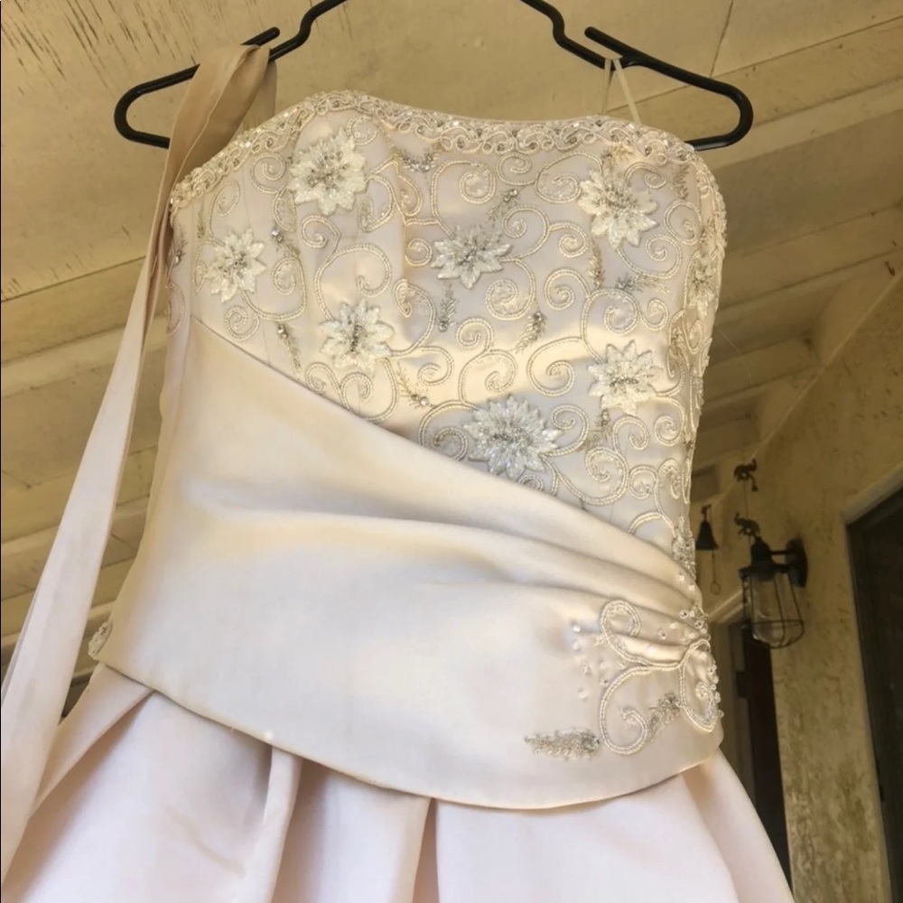 Never worn wedding dress by Maggie Satters